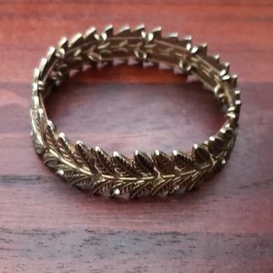 Ash gold tone metal leaf bracelet
